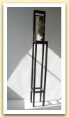 44- Teste sedute, legno e terracotta, 152x19x19 cm. 2005.jpg